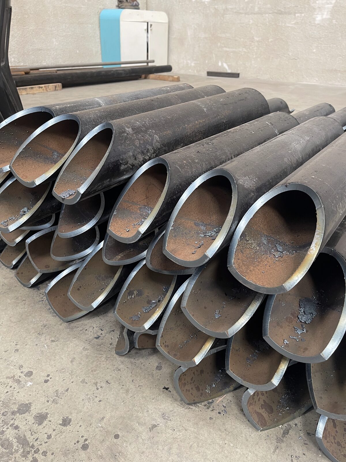 Large-bore coped tube