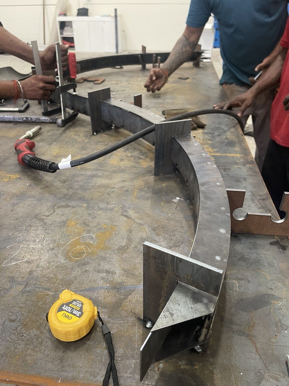 Curved steel frame assembly