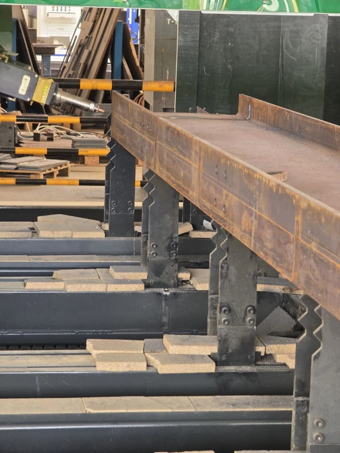 An I-beam moving through the beam laser line.