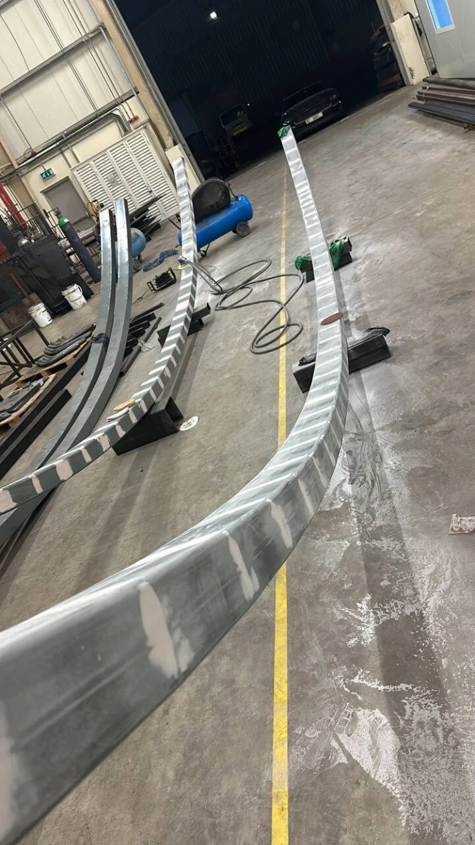 A curved fabricated profile