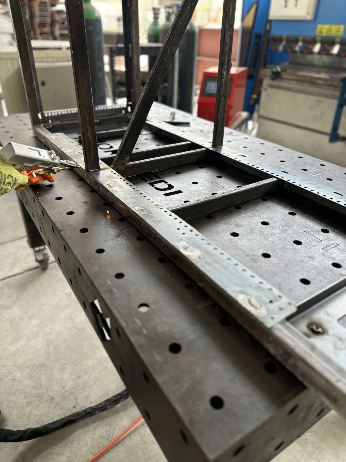 Laser welding a fabricated frame