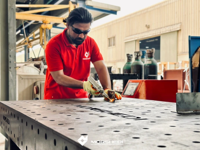 Operator running the laser welding cell