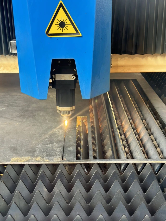 The CNC cutting head following a programmed path.