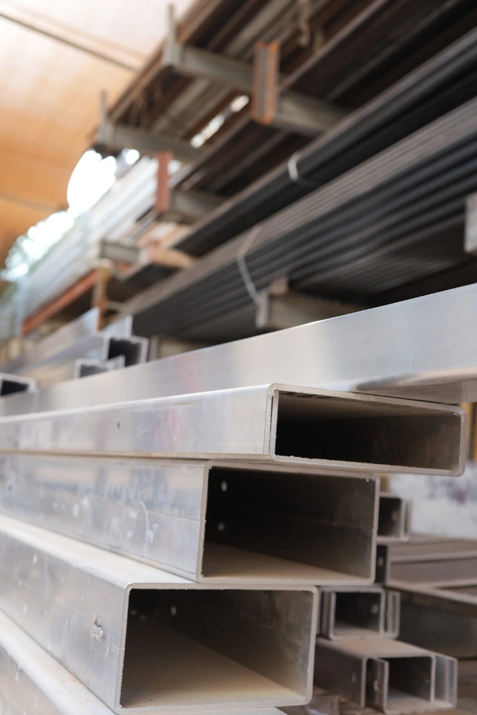 Square sections cut and stacked for a frame package.