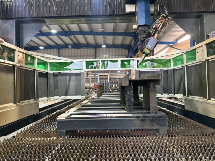 A multi-axis laser system cutting to a digital design