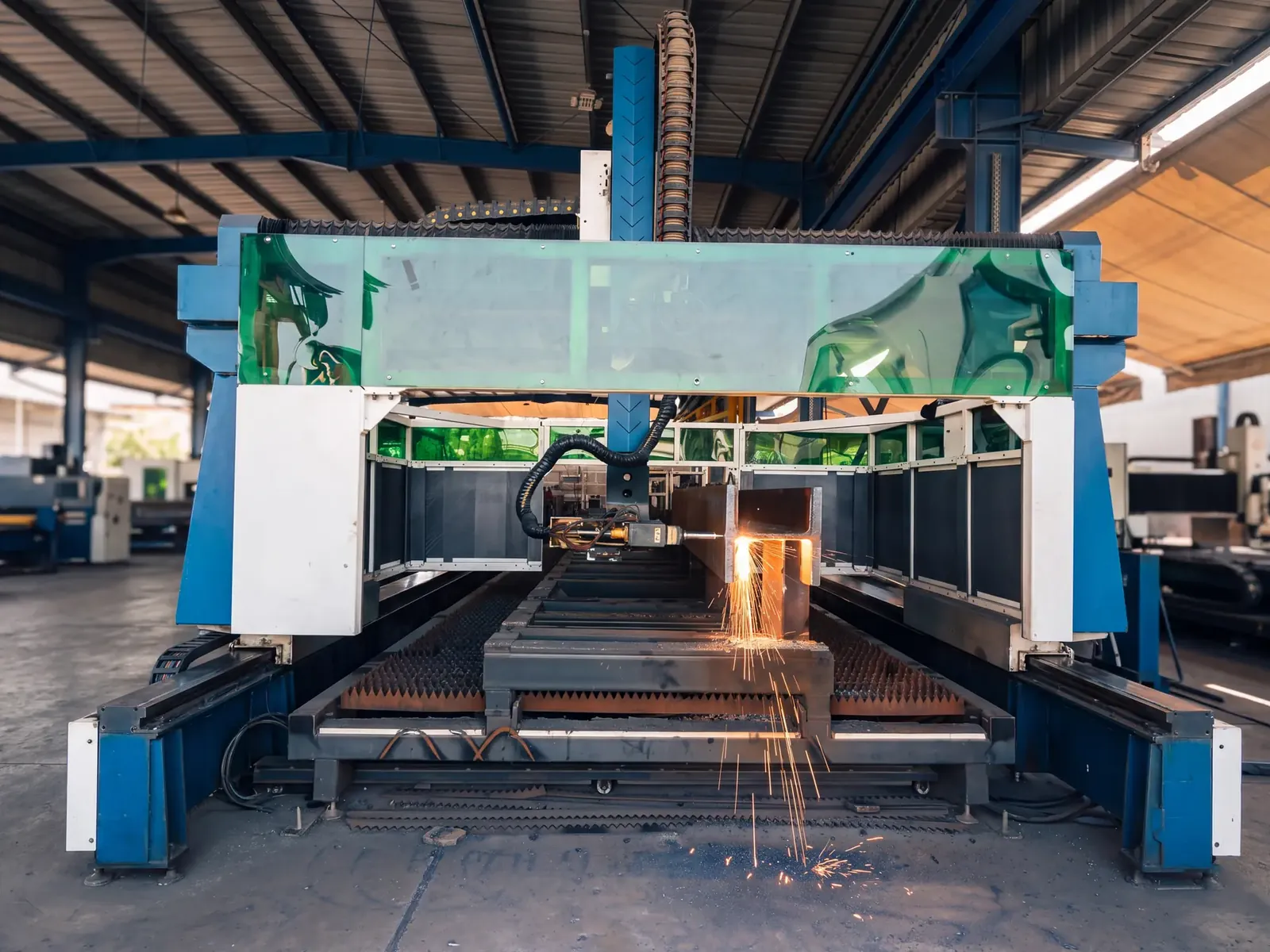 Gantry beam laser cutting machine cutting a steel H-beam at Morshedi, Dubai Industrial City