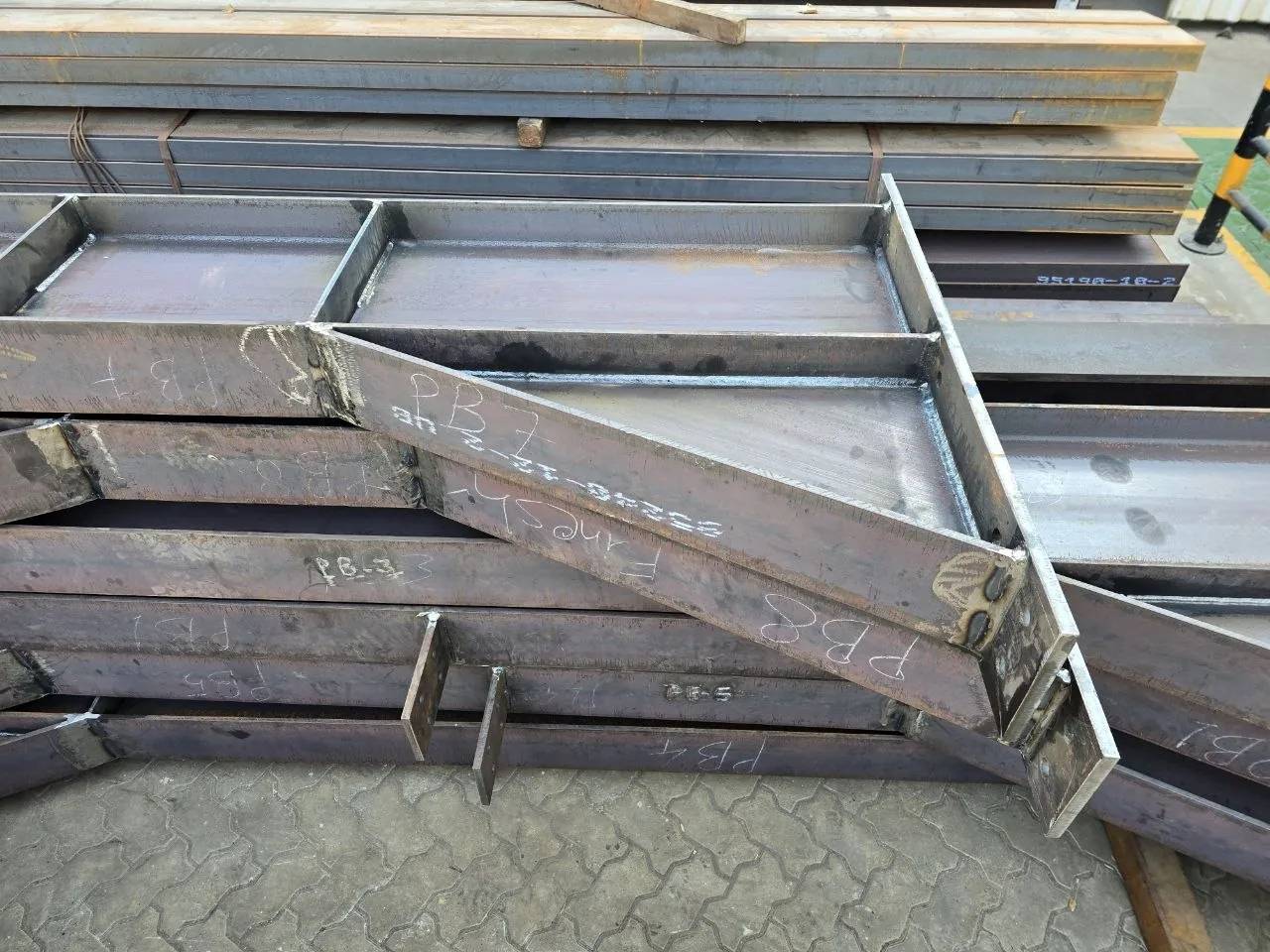 Fabricated steel beams with part marks PB7 and PB8 ready for site assembly, Morshedi Dubai