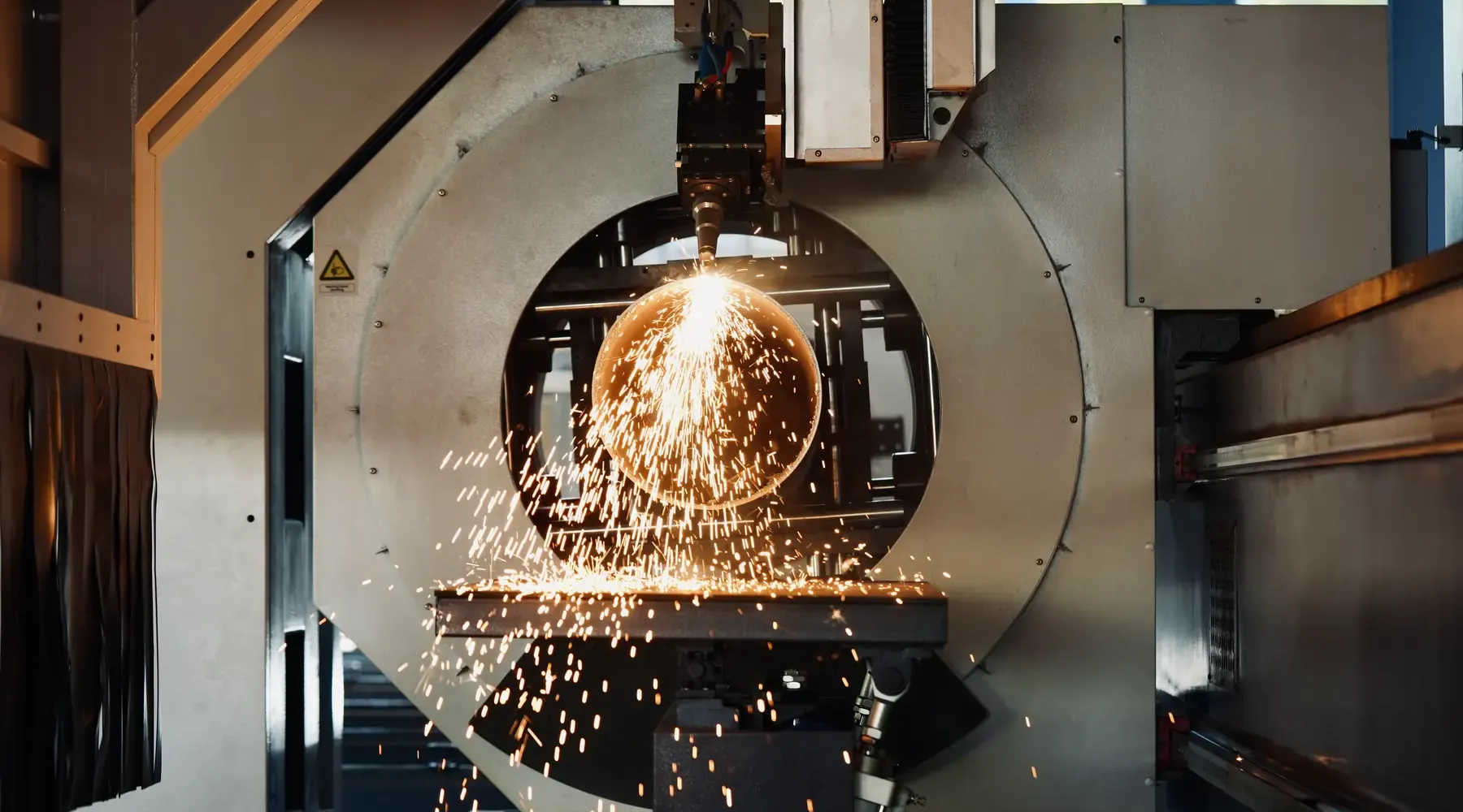 Round steel pipe being laser cut at Morshedi, Dubai