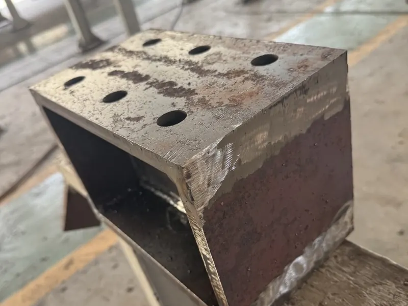 Heavy steel bracket with bevel cut edges and bolt holes, laser cut at Morshedi